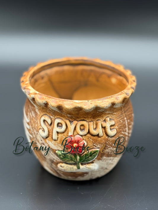 Brown "Sprout" with red flower
